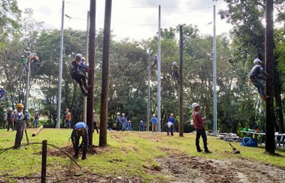 Line crew working outdoors on utility poles